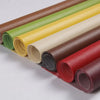 Rolls of self-adhesive PU leather patches in various colors including brown, green, yellow, beige, and red.