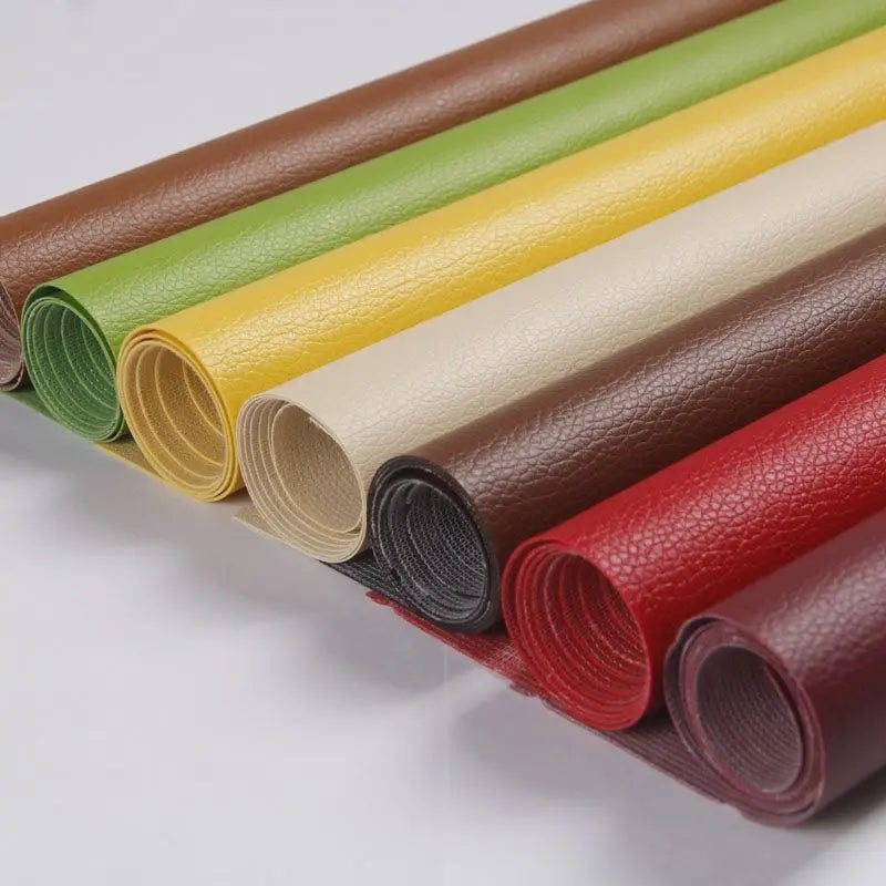 Rolls of self-adhesive PU leather patches in various colors including brown, green, yellow, beige, and red.
