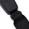 Black seat belt extender with a metal buckle and fabric strap for car seatbelt lengthening.