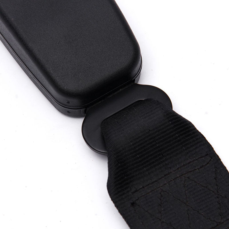 Black seat belt extender with a metal buckle and fabric strap for car seatbelt lengthening.