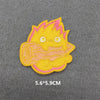 Yellow and pink embroidered iron-on patch featuring a stylized, spiky character design.