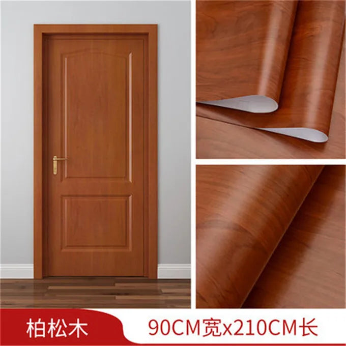 Close-up view of a wooden door panel showing rich wood grain texture and finish.