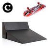 A finger skateboard set featuring a deck and a park ramp, shown next to a circular logo.