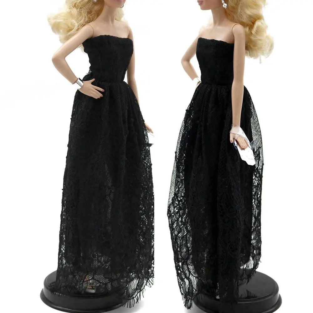 A fashion doll wearing a black lace dress and matching accessories.