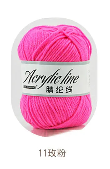 A ball of bright pink acrylic line yarn labeled as 11 ply for knitting and crochet.