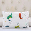 A white cartoon pillowcase featuring various colorful animal and geometric shapes for kids.