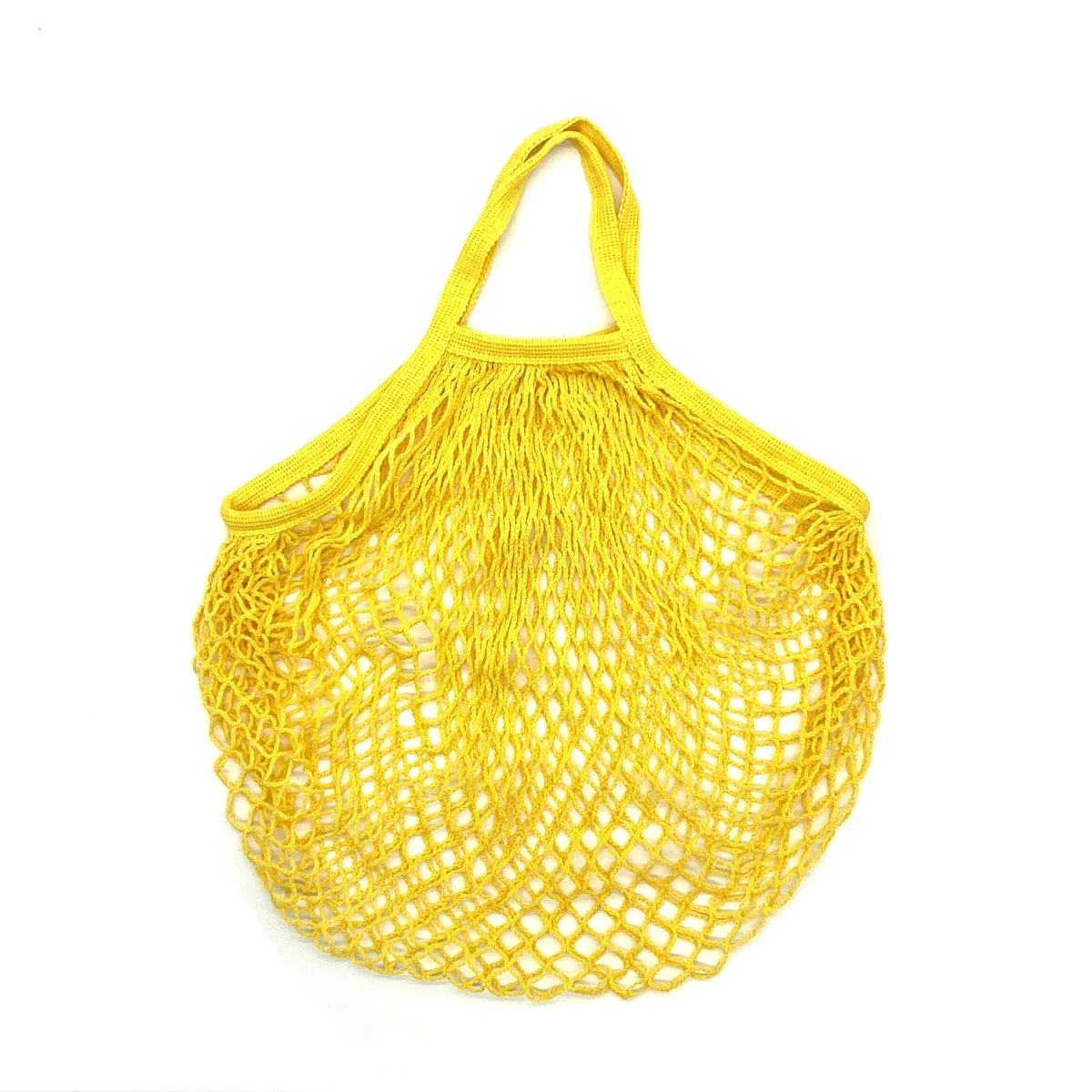 A bright yellow mesh produce bag made of organic cotton, used for reusable shopping.
