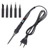 A black soldering iron with an LCD display and a coiled wire, shown alongside various tips.