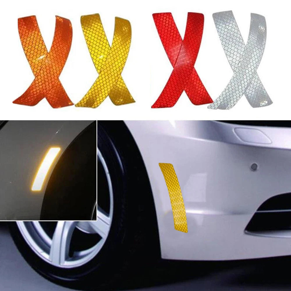 Two packs of reflective safety stickers shaped like Xs in orange and yellow colors applied to a car fender.