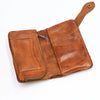 A brown vintage cowhide leather bi-fold wallet with a stitched flap and leather strap.
