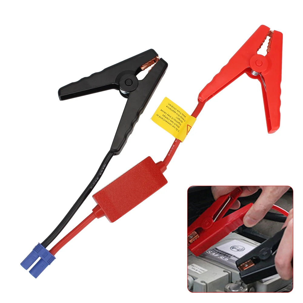 Red and black jump starter clamps with an EC5 connector cable shown next to a hand.