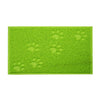 A bright lime green cat litter mat with embossed paw print designs.