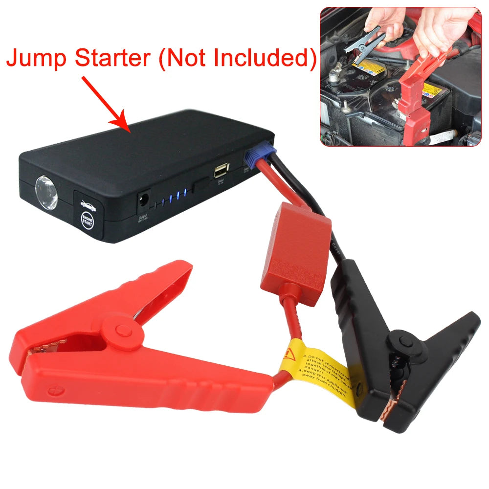 A black jump starter clamp with a red handle and yellow connector cable is shown next to an automotive battery.
