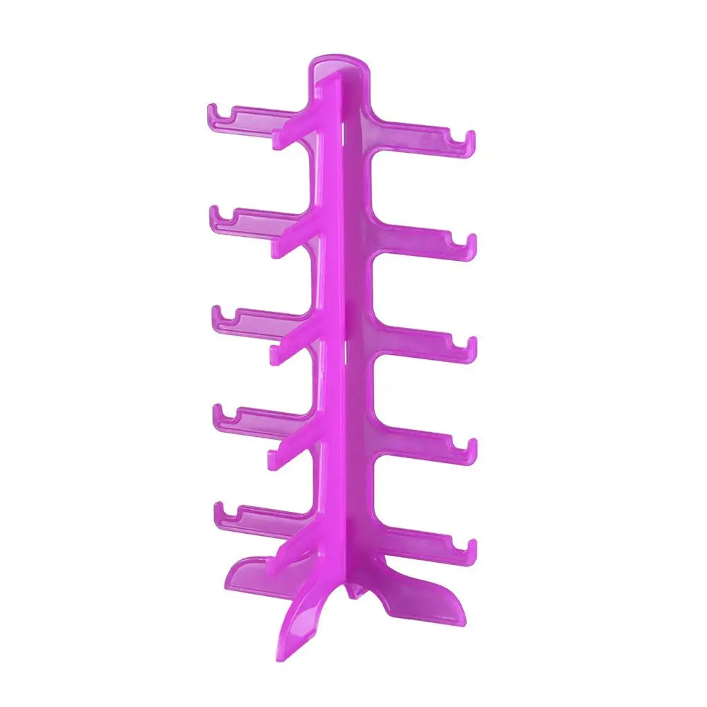 A bright pink stackable display stand for holding and organizing sunglasses and reading glasses.