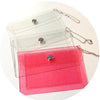 A set of three glitter PVC card holders in clear, pink, and magenta colors with gold chains.