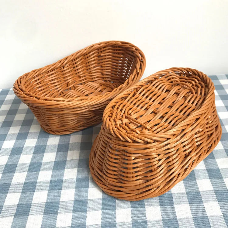 A handwoven wicker serving basket with a lid, made of natural brown wood, resting on a blue and white checkered cloth.