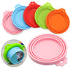 A set of three colorful reusable silicone food storage lids in pink, blue, and orange are displayed, with one lid shown on a 