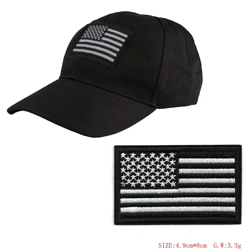 Black baseball cap with an embroidered American flag patch on the front