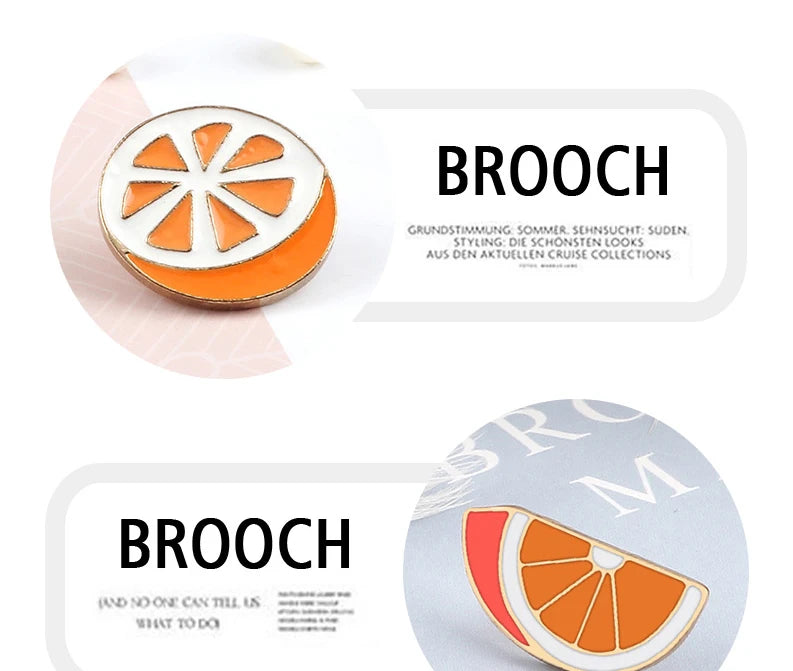 A round enamel brooch pin shaped like a slice of orange with white segments.