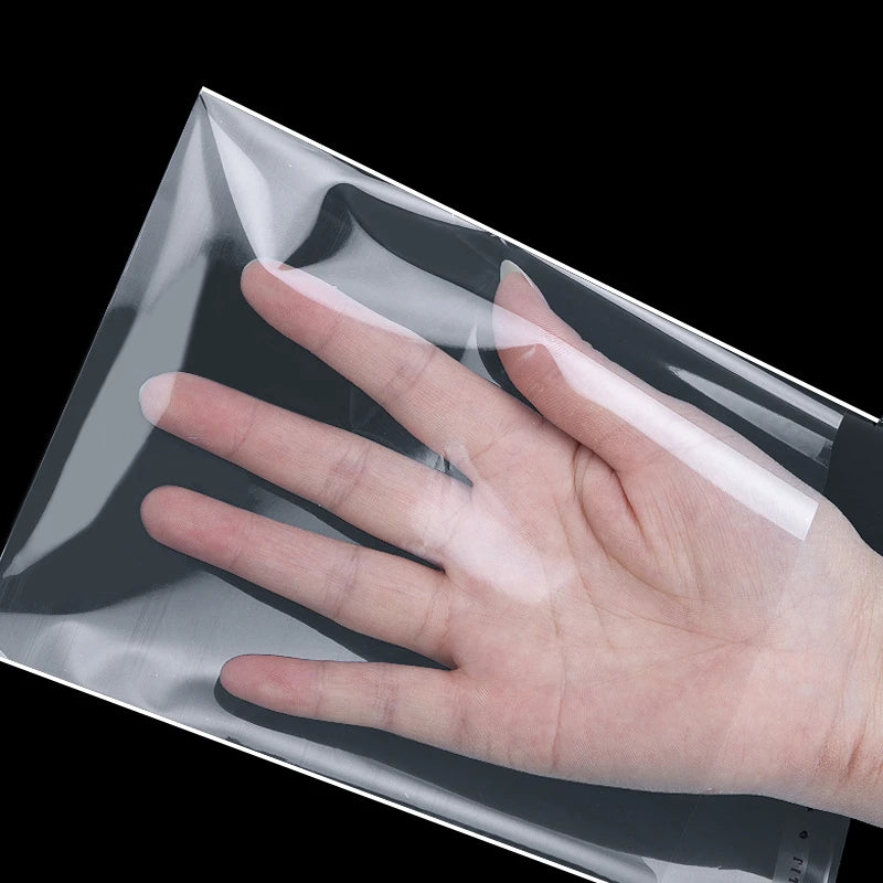 A hand is shown pressing against a clear self-adhesive resealable storage bag.