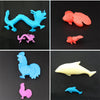 Set of colorful magical water-growing ocean animal toys including blue, pink, and orange sea creatures.