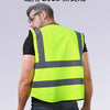 A man wearing a bright yellow high-visibility safety vest with reflective stripes, shown from the back.