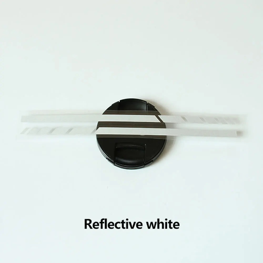 A rectangular reflective white vinyl mirror decal with a black mounting base.