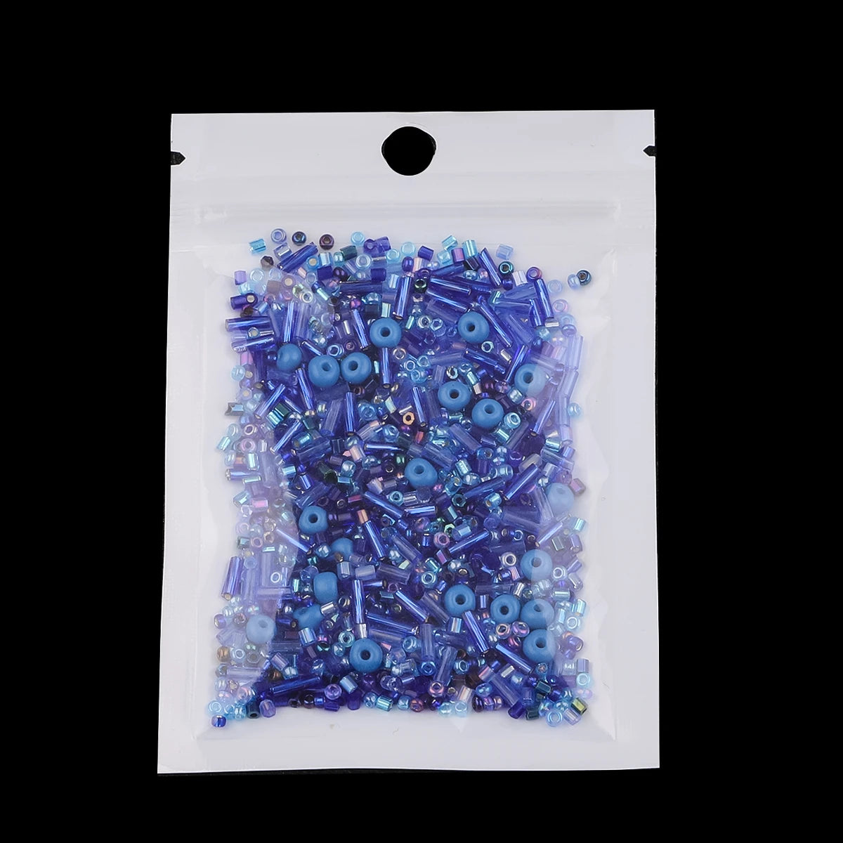 A clear plastic bag filled with mixed blue and purple glass seed beads for jewelry making