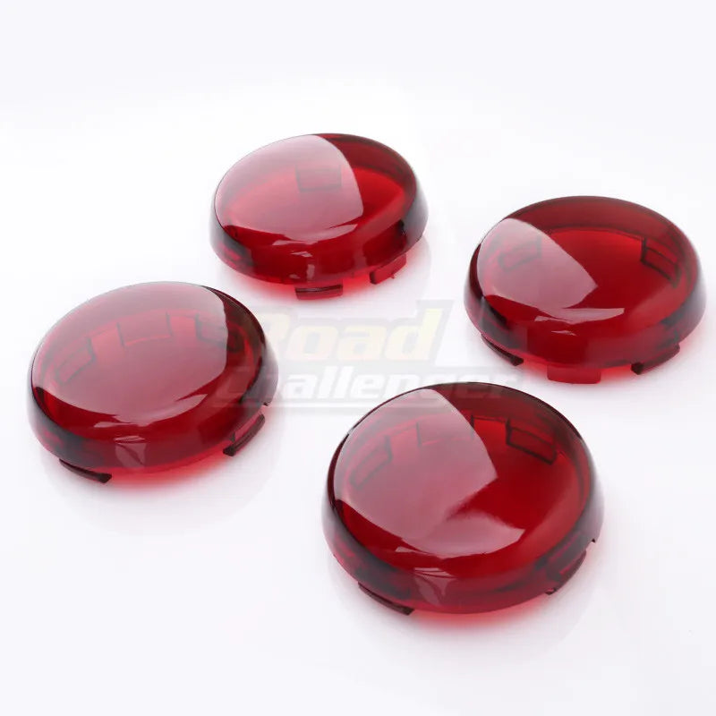 Three round, translucent red LED turn signal light lens covers for Harley Davidson motorcycles.
