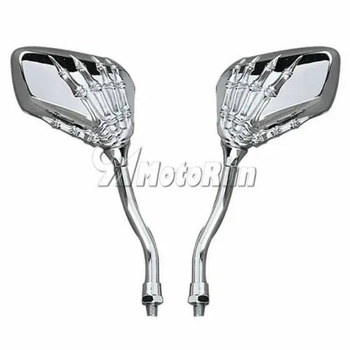 A pair of chrome universal skull hand motorcycle side mirrors.