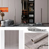 Roll of red silk wood grain wallpaper film showing a textured, natural wood pattern.