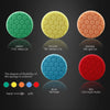 A display of hexagonal foam buffing pads in various colors and hardness levels, including green, yellow, orange, blue, and re