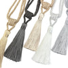 A set of two elegant tassel curtain tiebacks in natural and gray tones.