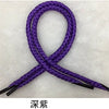 A purple braided string rope tied in a bow shape.