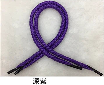 A purple braided string rope tied in a bow shape.
