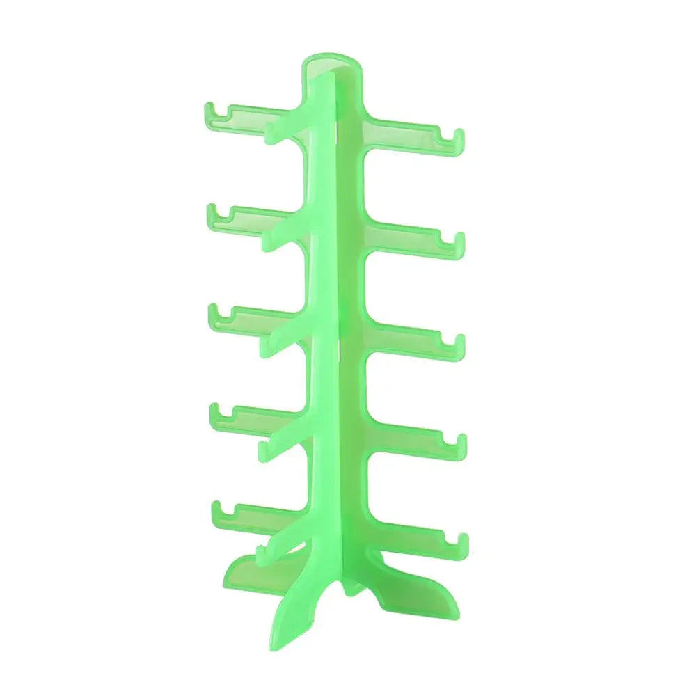 A bright green stackable display stand for holding sunglasses and reading glasses.