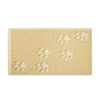 A rectangular beige cat litter mat with paw print designs molded into the surface.