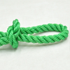A thick green heavy-duty polyethylene rope tied in a knot, shown against a white background.