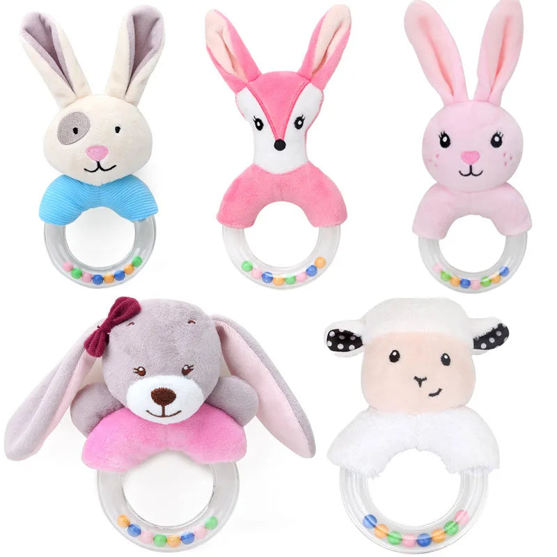 A collection of soft plush baby rattle toys shaped like various cartoon animals, including a rabbit, fox, and elephant.