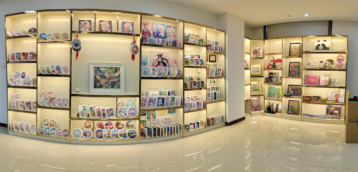 A display of DIY Diamond Painting kits featuring various scenery and mosaic art designs.