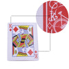 A playing card featuring a crowned figure and the letter K, with a magnified view of red and white markings.