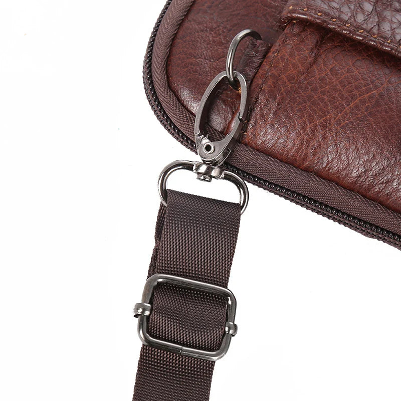 A brown vintage leather multi-pocket waist bag with a silver metal clasp and adjustable strap.