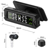 A black solar-powered tire pressure monitoring system with a display and a separate sensor unit.
