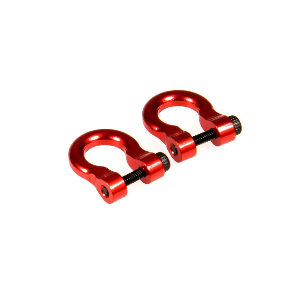 A pair of red metal alloy tow shackles for an RC crawler, packaged as a 2-pack.