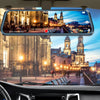 Interior view of a car showing a wide-angle dash cam recording a nighttime cityscape with illuminated buildings.
