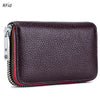 A dark purple genuine leather card holder with a zipper and RFID protection feature.