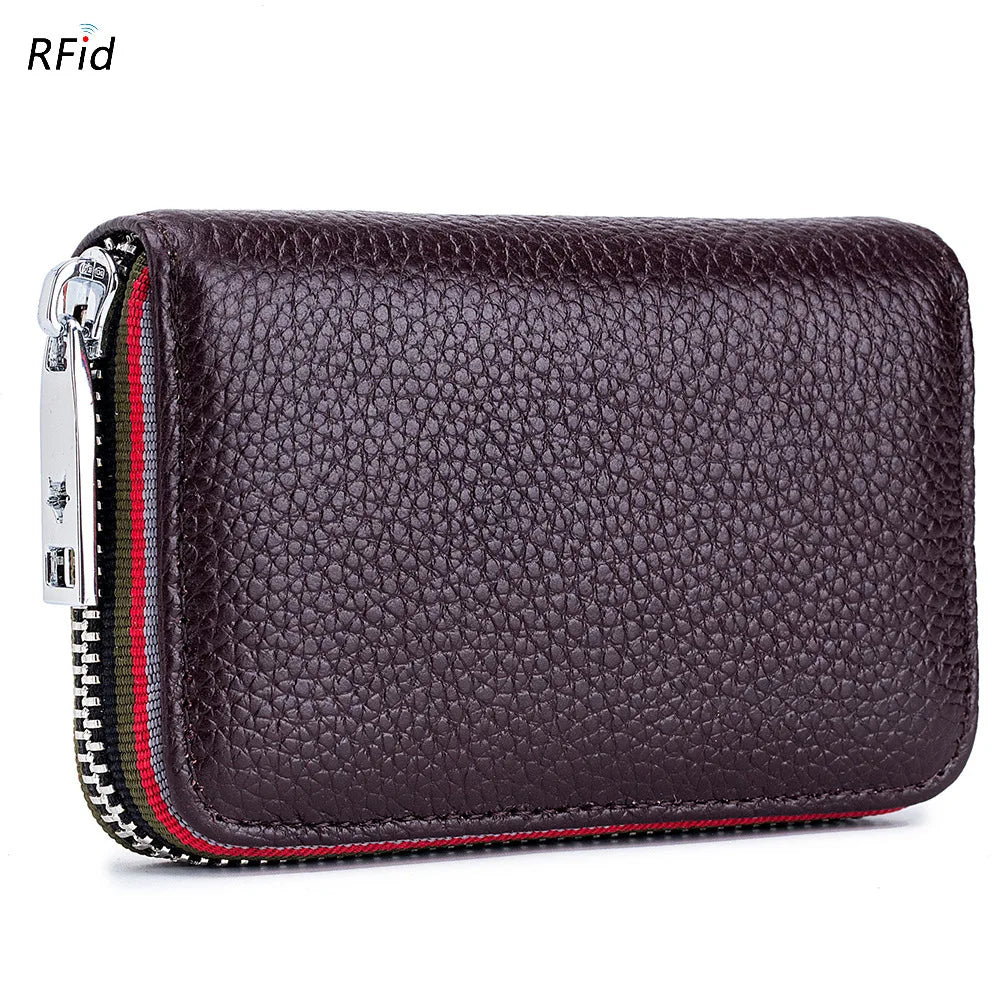 A dark purple genuine leather card holder with a zipper and RFID protection feature.