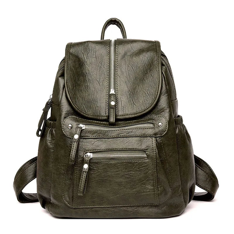 A dark olive green faux leather women's backpack with multiple zippered compartments.