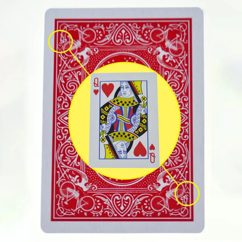 A red playing card from a marked stripper deck featuring a Queen of Hearts, with circles highlighting specific areas.