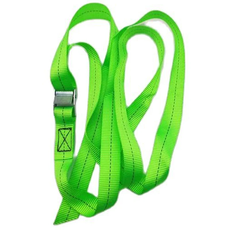 A set of bright green heavy-duty tie-down straps with metal buckles.
